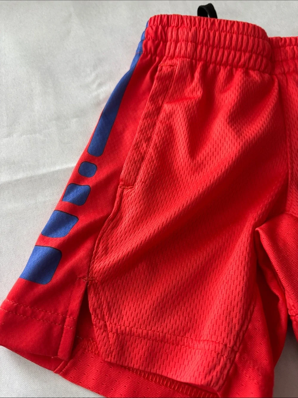 Nike Red Kids Athletic Shorts with Blue Logo and Side Panels size XS